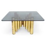 Designer Unknown, Coffee table with tubular supports, circa 1970, Brass, smokey glass, 45.5cm