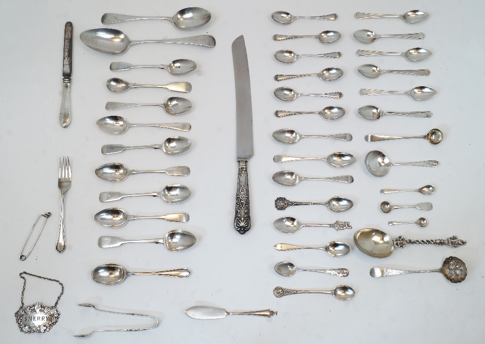 A group of silver, to include: assorted spoons, mostly comprising teaspoons, including two William