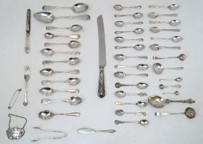 A group of silver, to include: assorted spoons, mostly comprising teaspoons, including two William