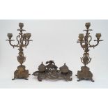 A brass Rococo styled double inkwell, late 19th / early 20th century, the stand surmounted with a