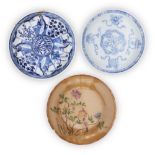 Three Chinese saucers, 18th-19th century, comprising a blue and white Kangxi 'ladies' saucer, with