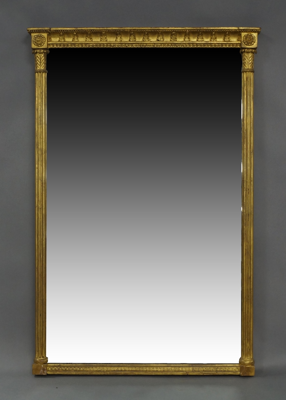 A giltwood and gesso pier mirror, 19th century, with beaded and egg and dart border, Corinthian