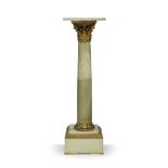 A gilt-bronze mounted onyx pedestal column, early 20th century, with a Corinthian capital, 102cm
