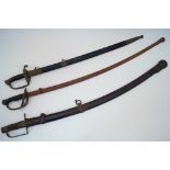 A group of three swords, each with a scabbard, to include a composite French Cavalry saber, the