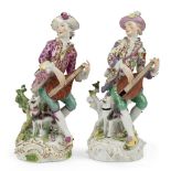 Two Meissen porcelain figures of musicians, c.1755, the decoration probably later, each playing a