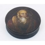 A Stobwasser type papier-mache snuff box, 19th century, of circular form, the pull-off top painted