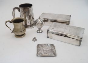 A small group of silver comprising: a cigarette box, of oblong form with hinged lid enclosing wood