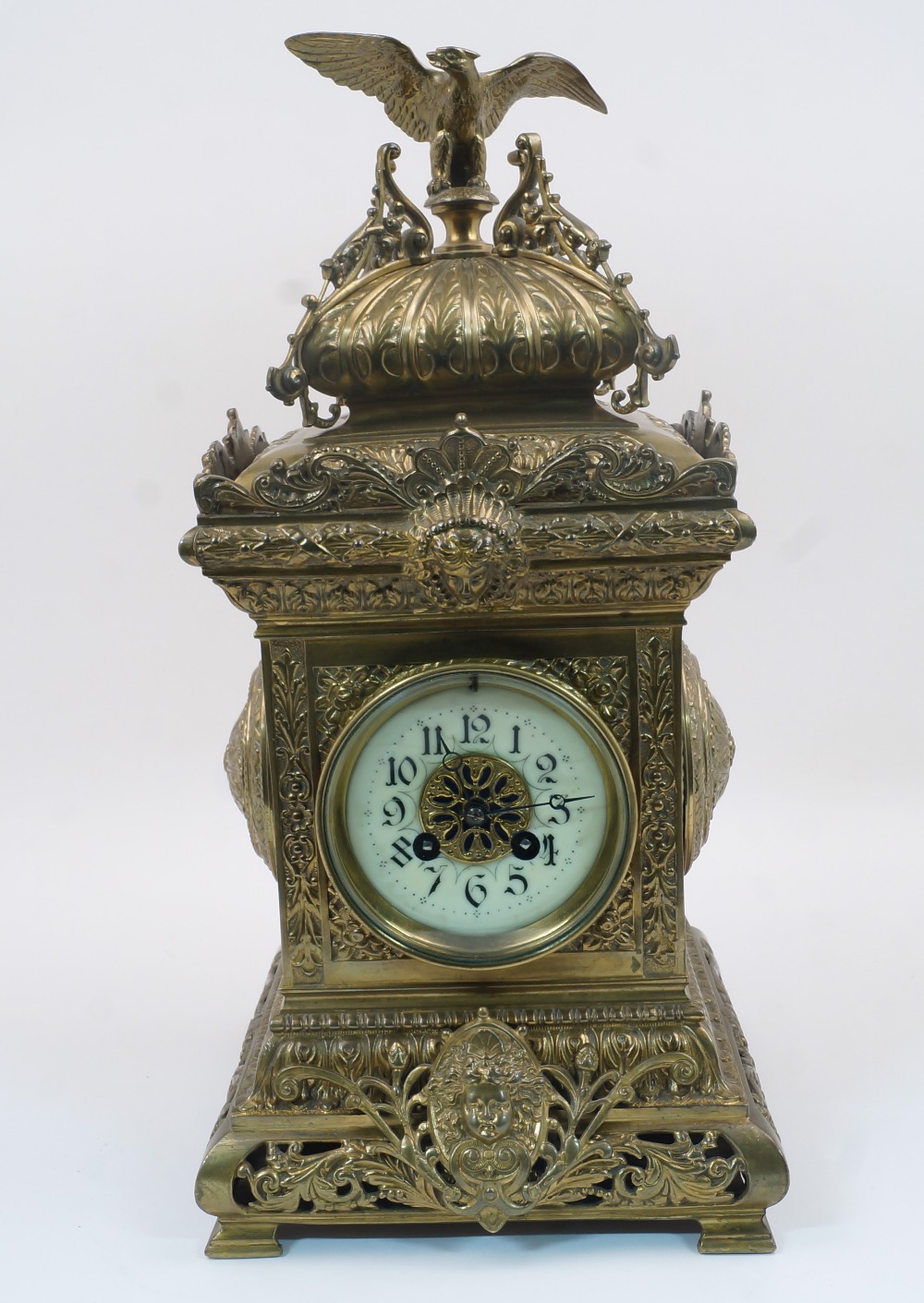 A French gilt-brass mantel clock, late 19th century, the architectural case surmounted with an eagle