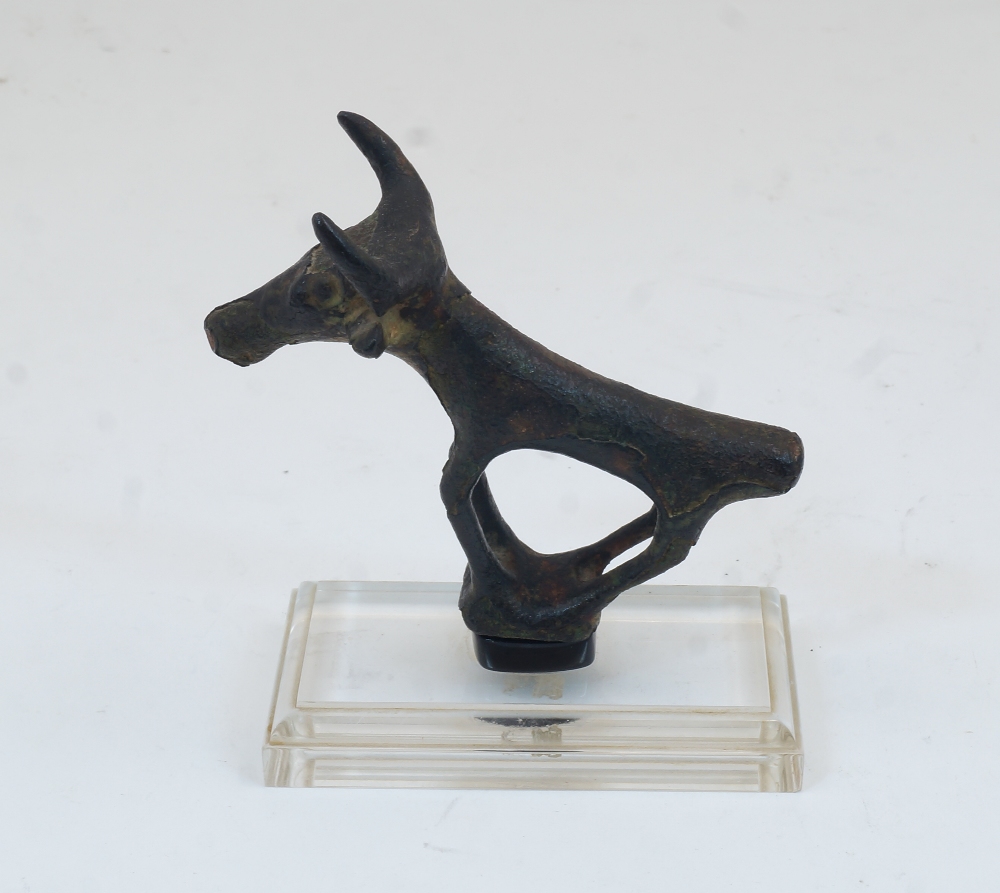 A bronze Etruscan style bull, after the Antique, standing four square with stylised elongated