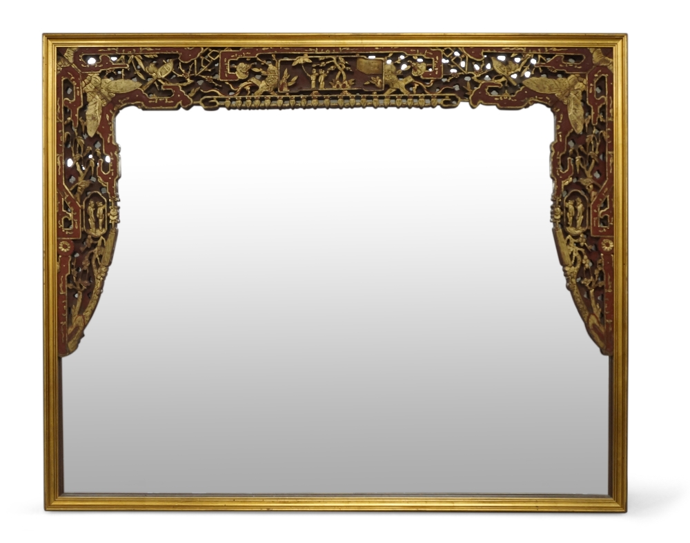 A Chinese gilt lacquer wood panel mounted as wall mirror, early 20th century, pierced and carved