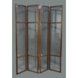 A glazed mahogany four fold screen, 21st century, with bevelled glass panels, 230cm x 200cmscratches