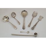A small group of silver sifting and serving implements, comprising: a George III silver sugar