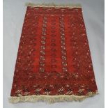 A Bokhara rug, 20th century, gull motifs on a red ground, contained by geometric border, 208cm x