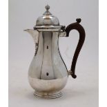 A silver coffee pot, Birmingham, 1935, Adie Brothers Ltd., the hinged lid with knopped finial,