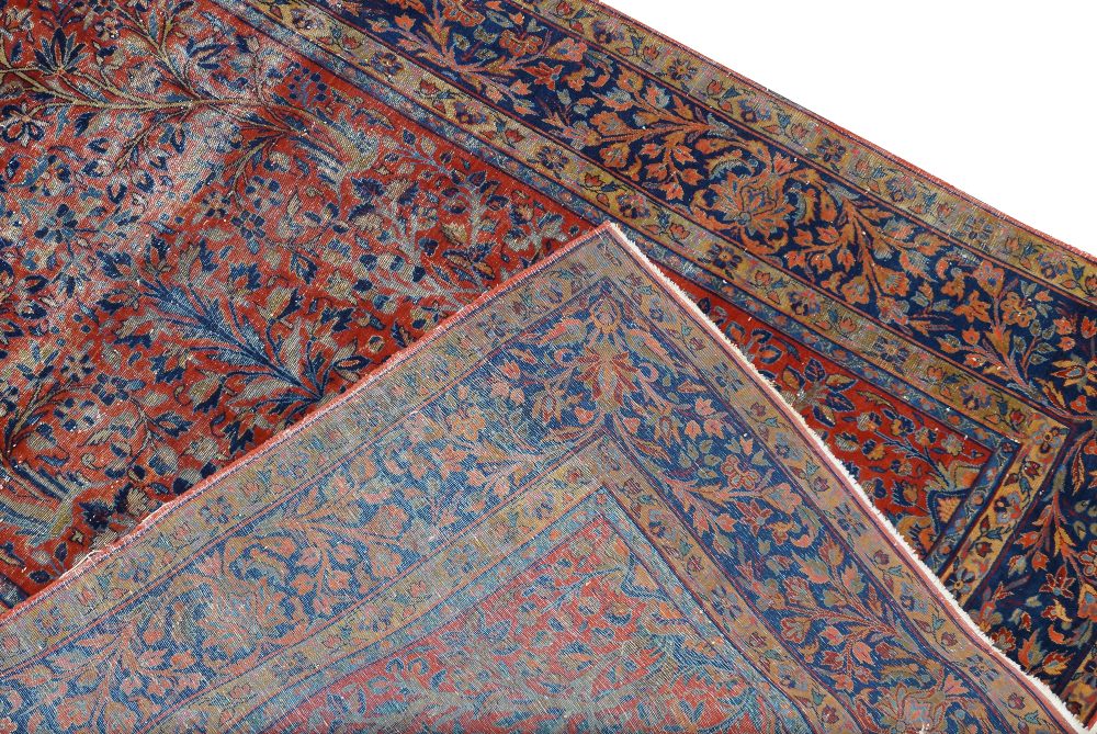 A pair of central Persian Sarouk rugs, 20th century, with vase of flowers central design, on a red - Image 5 of 5