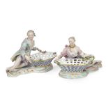A pair of Meissen porcelain figural sweetmeat baskets, late 19th century, blue crossed swords marks,