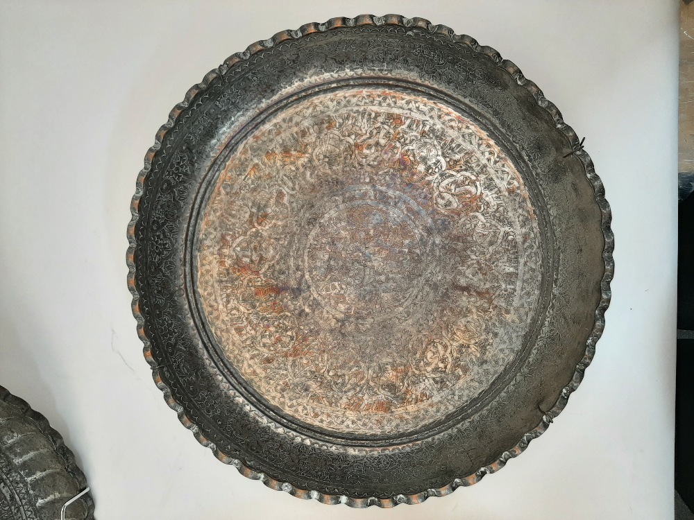 Two Qajar tinned copper dishes, late 19th / early 20th century, each elaborately chased with foliate - Image 2 of 5