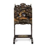 A Japanese lacquer bureau, Meiji period, the front panel lacquered and inlaid with mother of pearl