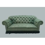 A Victorian style Chesterfield sofa, 20th century, with green button back upholstery, raised on