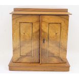 A Victorian walnut table collectors cabinet, mid-19th century, the line inlaid drawers enclosing