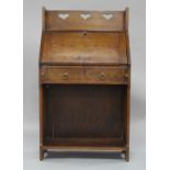 Liberty & Co. a stained oak 'Chaucer' bureau, c.1905, the raised gallery with pierced heart