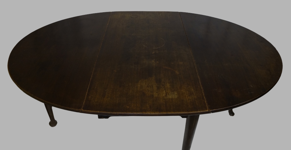 A mahogany drop leaf dining table, 19th century, raised on cylindrical tapering supports to pad - Image 3 of 3