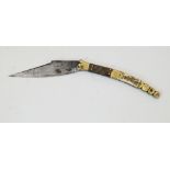 A Spanish folding Navaja knife, 19th century, the shaped brass handle grips with bone and horn