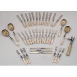 A Victorian set of mother-of-pearl handled cutlery, with silver acanthus chased collars and silver