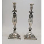 A pair of German candlesticks, Berlin, c.1830, by Georg Friedrich Fournier, with urn surmount