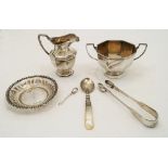 A mixed group of silver, comprising: a milk jug and twin handled sugar bowl, London, 1925, Thomas