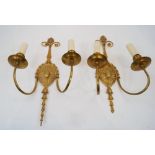 A pair of gilt-bronze twin-light wall appliques, second half 20th century, each backplate with
