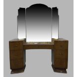 An Art Deco burr walnut dressing table, with triptych mirror above central long drawer flanked by