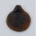 A glass cameo with a Menorah, 20th century, attachment loop to top, 3.5cm. highPlease refer to