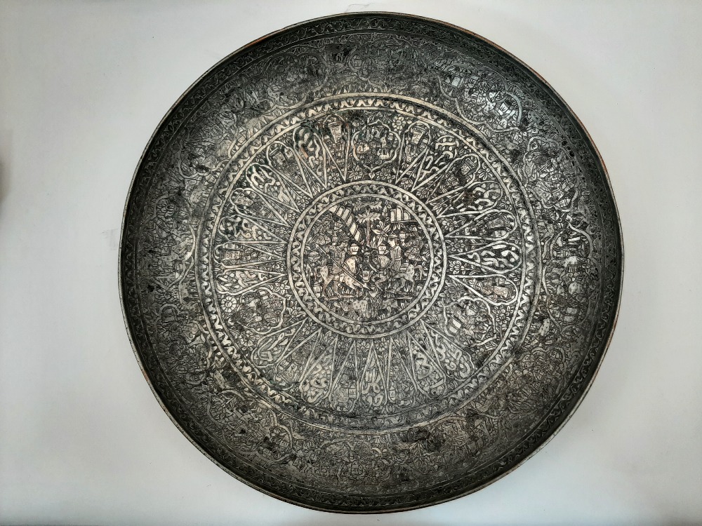 Two Qajar tinned copper dishes, late 19th / early 20th century, each elaborately chased with foliate - Image 4 of 5