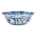 A Chinese blue and white 'Kraak' foliate rim bowl, Wanli period, standing on a short foot rising