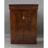 A French flame mahogany secretaire, 19th century, frieze drawer above fall front, enclosing fitted