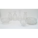 A group of cut glass bowls and decanters, 20th century, to include a bulb shaped decanter with