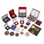 A collection of commemorative coins and medals, comprising: a cased 1978 Greek coin; two cased Royal