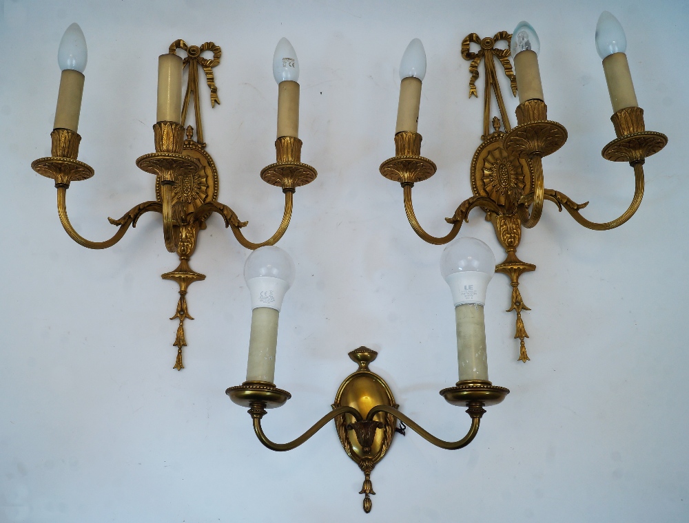 A set of four gilt bronze three-branch wall appliques, late 20th century, with ribbon-tied