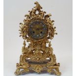 A French Rococo Revival gilt-bronze mantel clock, second half 19th century, the case with floral