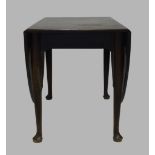A mahogany drop leaf dining table, 19th century, raised on cylindrical tapering supports to pad