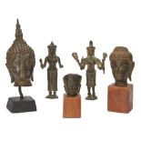 Five Southeast Asian bronzes, 19th century, comprising two Khmer style standing figures, two Thai
