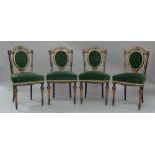 A set of four Victorian aesthetic ebonised dining chairs, burr walnut inlaid, green velour button