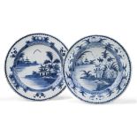 A near pair of English delft chargers, possibly Lambeth, 18th century, each decorated with