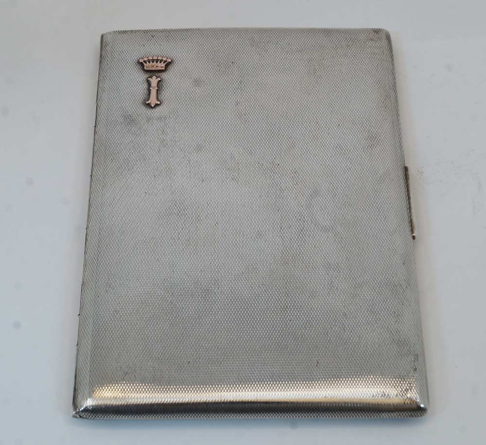 An engine-turned cigarette case, the interior stamped 925, makers mark EB, and with presentation