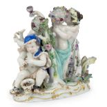 A Meissen porcelain group emblematic of the Four Seasons, late 19th century, blue crossed swords