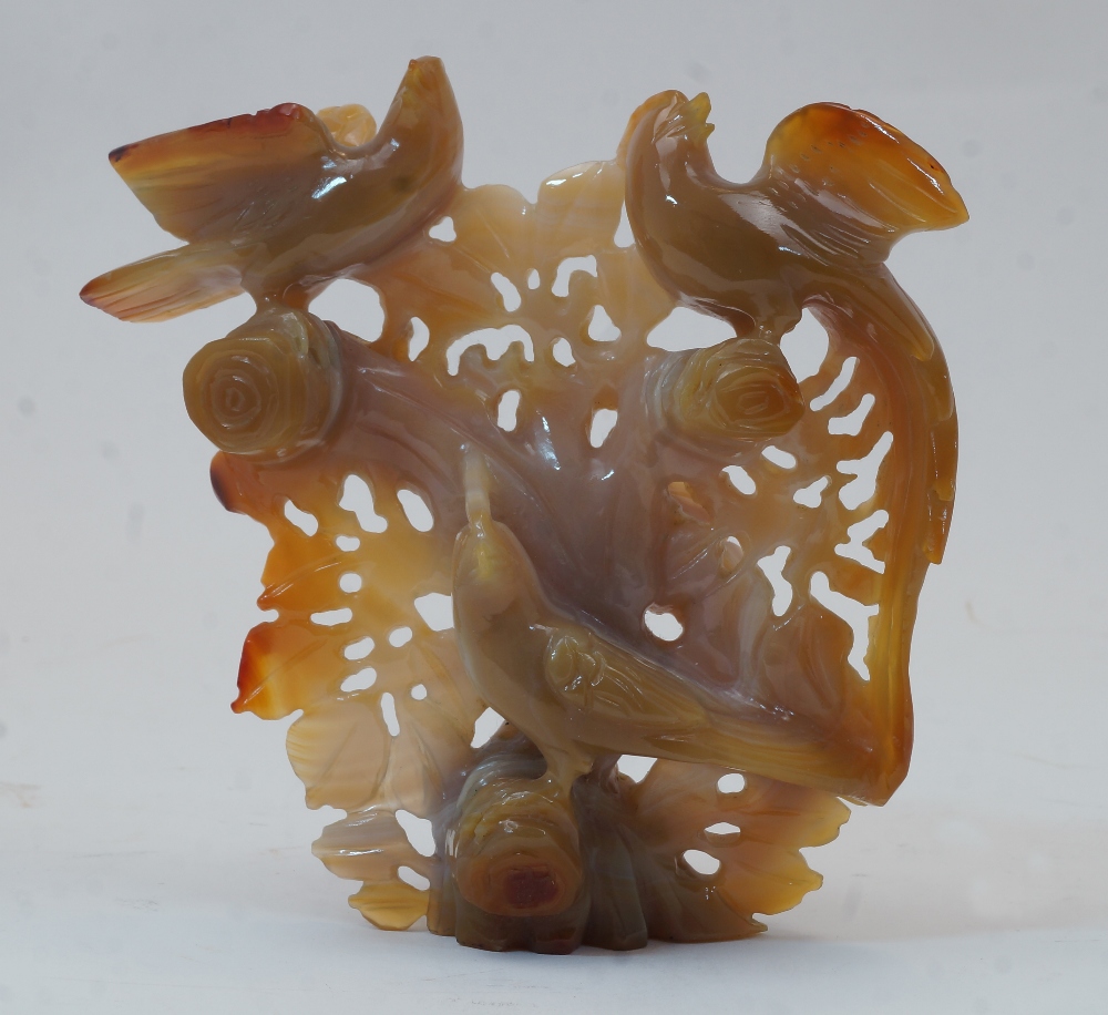 A Chinese agate 'birds' carving, 20th century, pierced and carved with three birds perched on