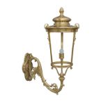A large Victorian style gilt metal wall lantern, with pineapple finial and acanthus leaf scrolling