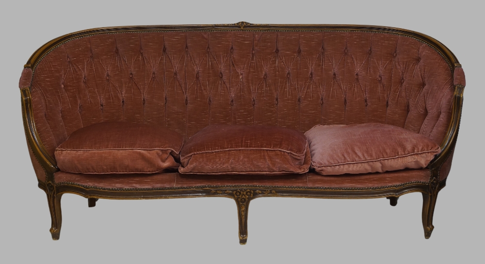 A French mahogany sofa, 20th century, with pink button back velour upholstery, raised on cabriole