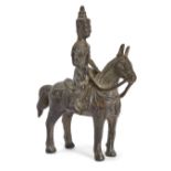 A Burmese bronze figure of a horse and rider, late 19th/early 20th century, the horse cast in a